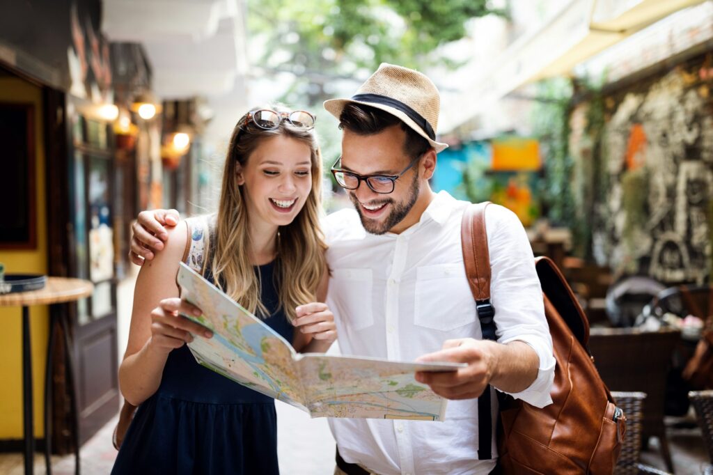 Tourist couple traveling. Travel. Walking on street. Portrait of beautiful young people