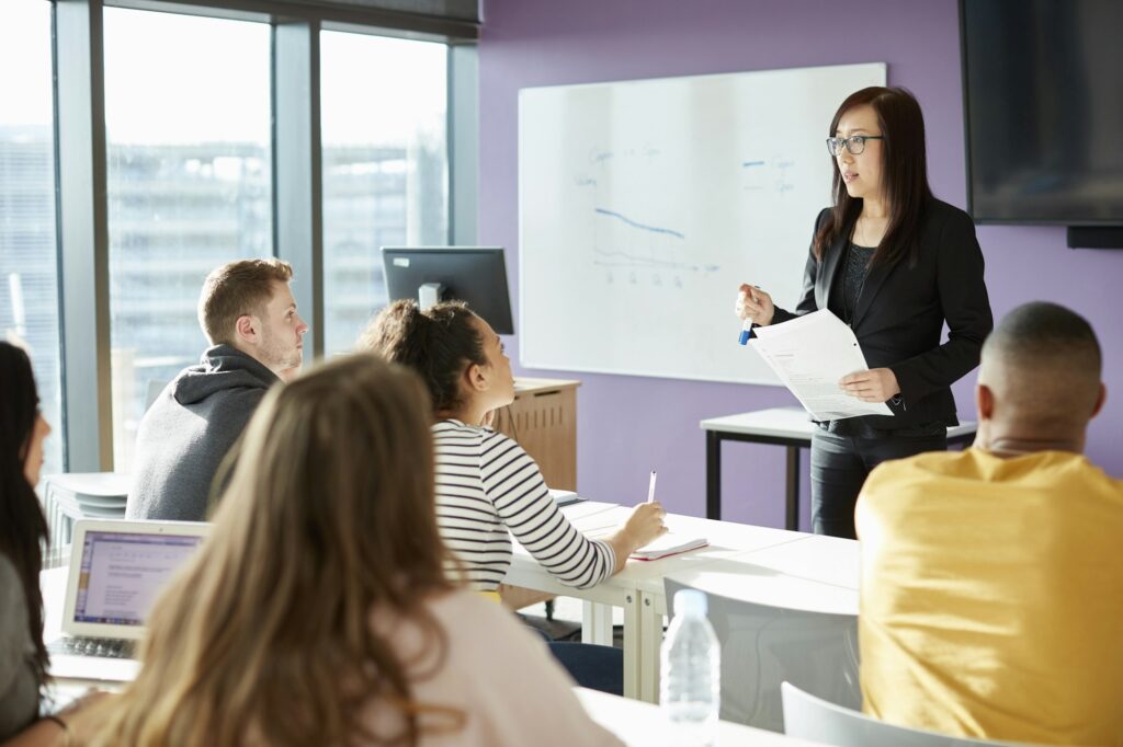 University lecturer and students in class