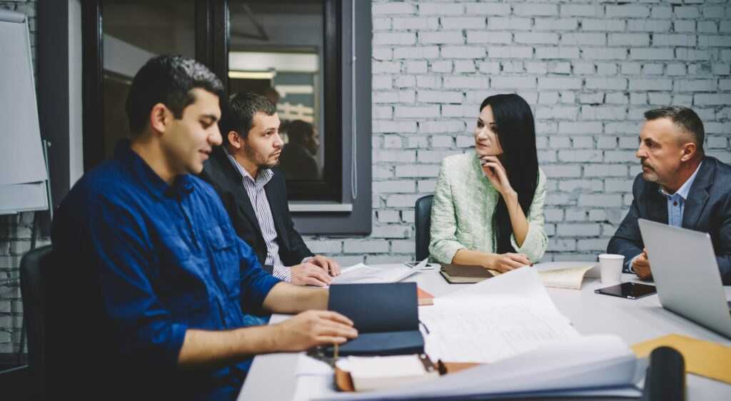 Group of professional experts discussing company productivity