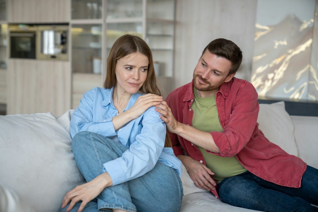 Smiling man empathizes with wife. Strong emotional connection between couple and ability to support.