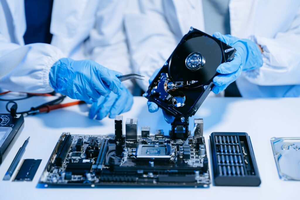 The technician is putting the CPU on the socket of the computer motherboard. electronic engineering